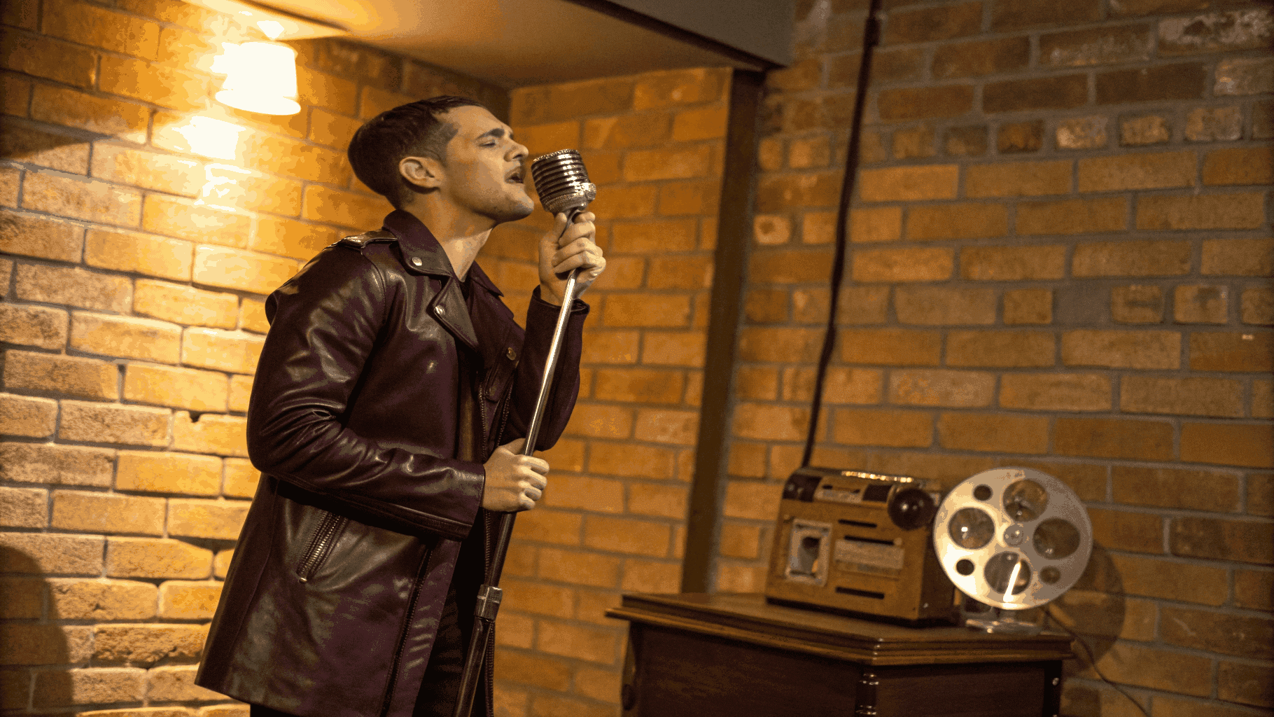 Soul artist performing in front of a vintage microphone